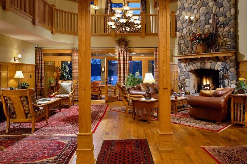 Lobby with chairs and stone fireplace