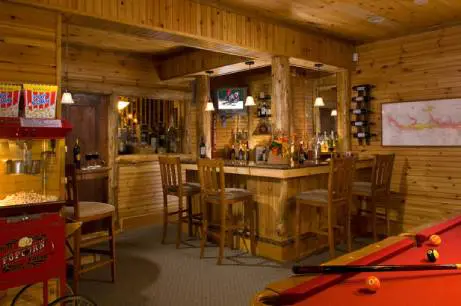 basement game room with bar area